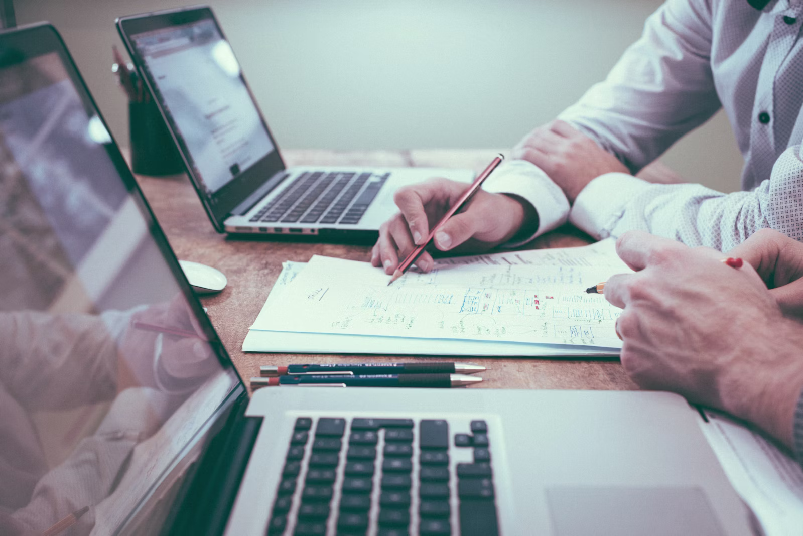 Owner reviewing analytics and documents on a laptop: a weekly review workflow ChatGPT Work is meant to accelerate