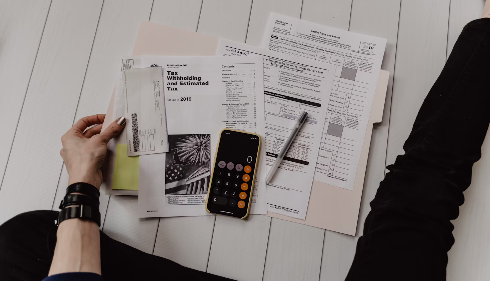 Invoices and financial paperwork on a desk: accounting and owner-review jobs called out in OpenAI's webinar lanes