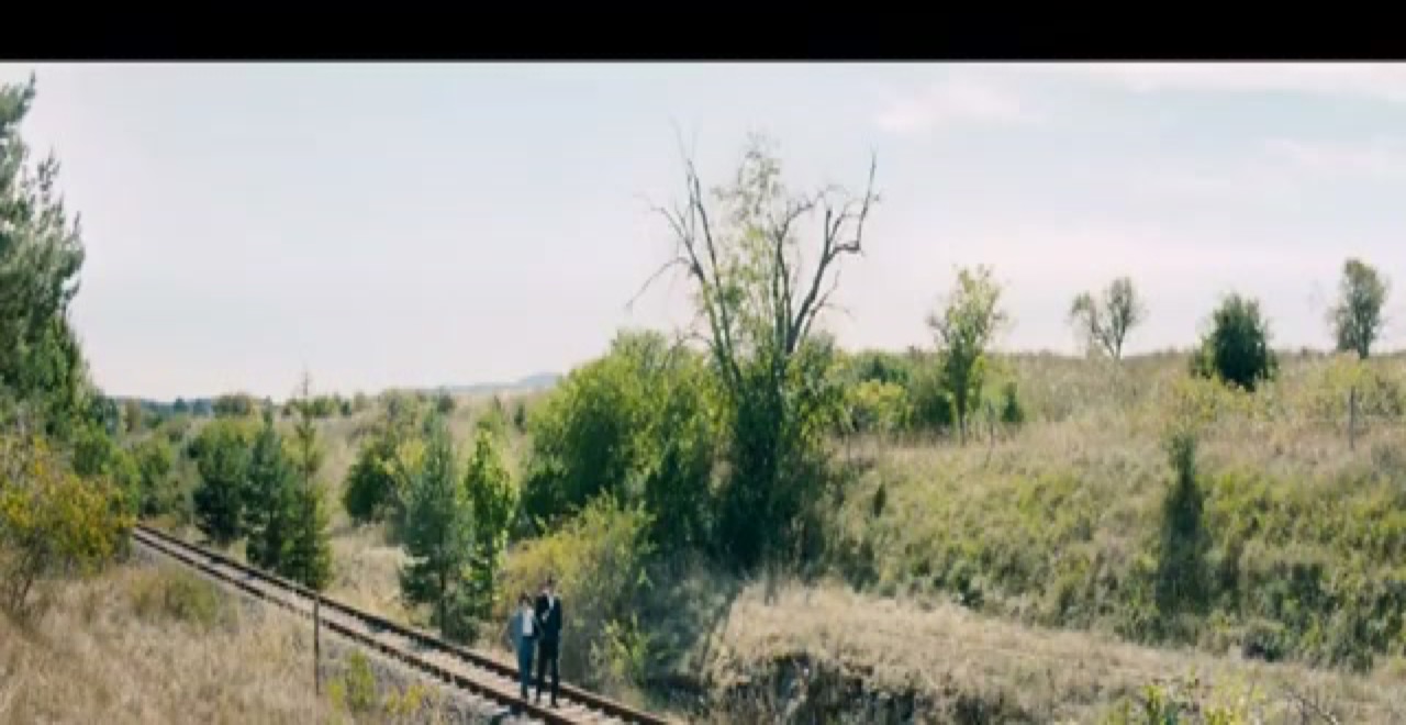 Kersten and Hedda walk a rural railway in I Is Another