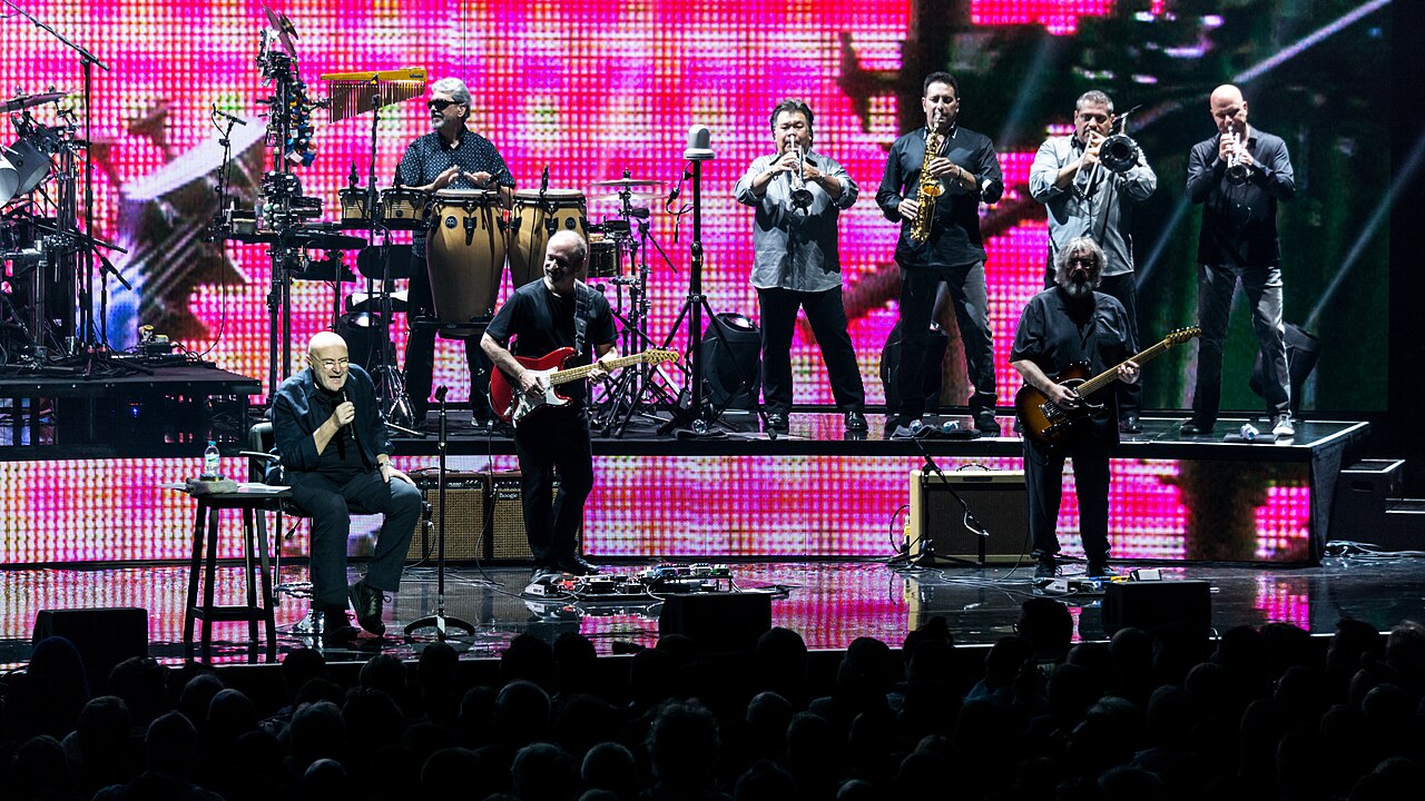 Phil Collins and band under LED screens at the Royal Albert Hall