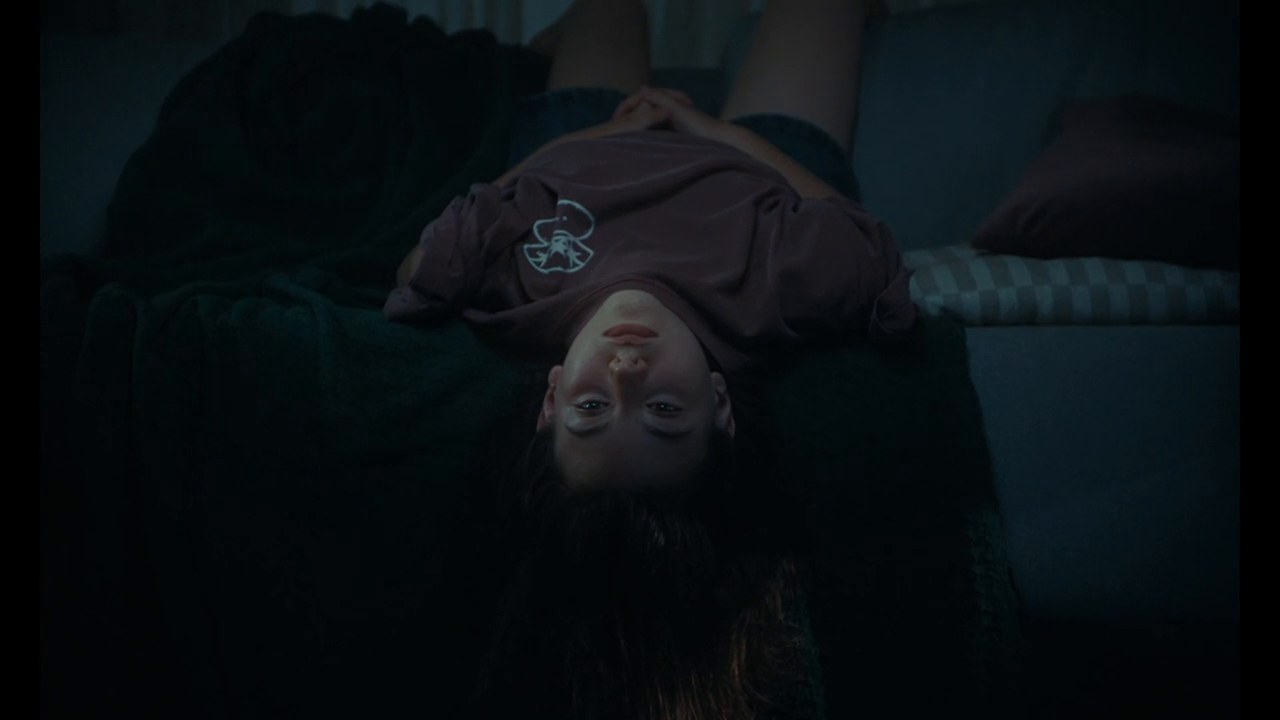 Bego upside down on a sofa in The Days Off trailer